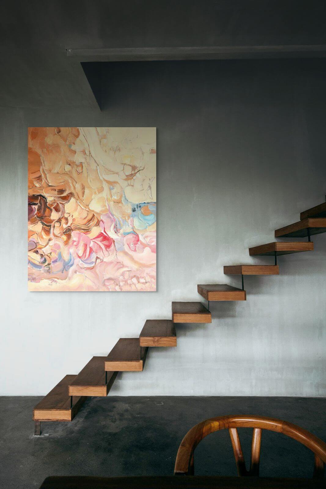 Original oil painting 'Earthbound Reverie' displayed above modern wooden stairs in a minimalist interior.