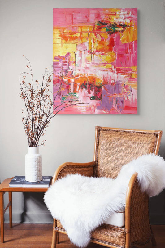 Original oil painting 'Heatwave in Bloom' by Paint Poet in a cozy living room setting with a rattan chair.