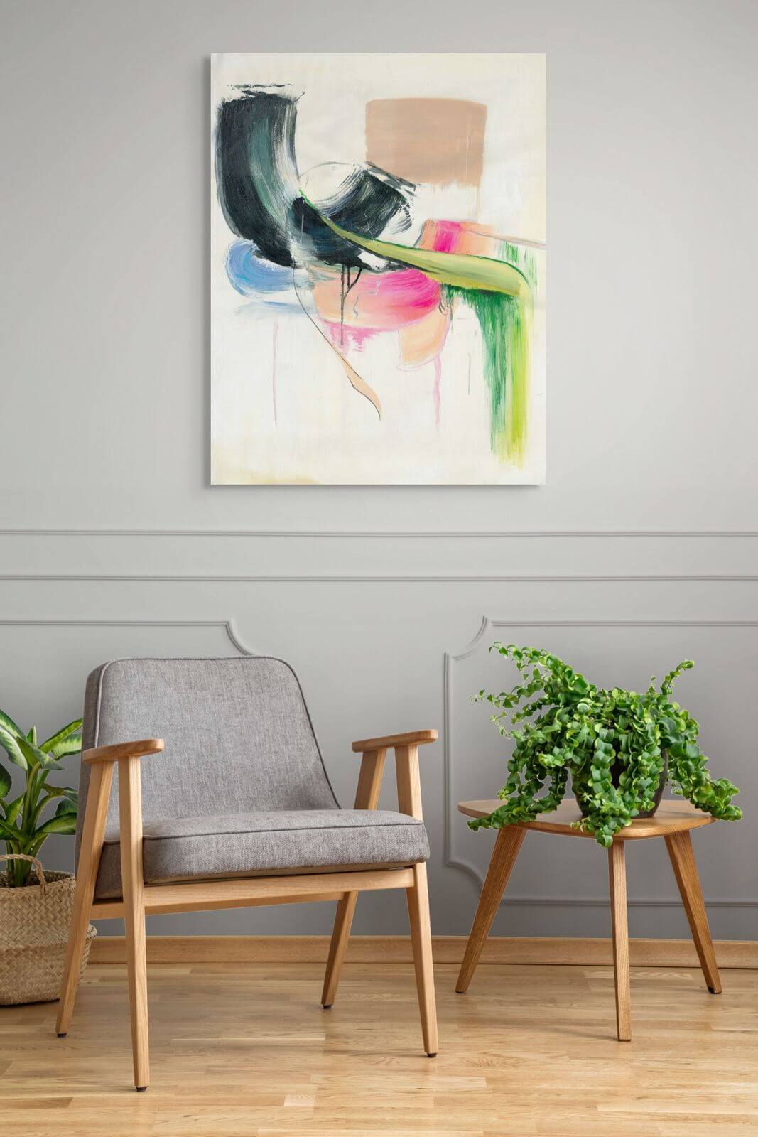 Original oil painting "Soft Collision" displayed in modern living room with gray chair and greenery.