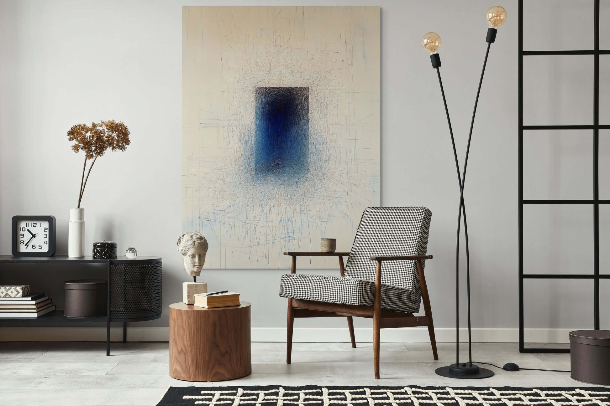 Original oil painting 'Singularity' displayed in modern living room, featuring a dark indigo form against a pale background.