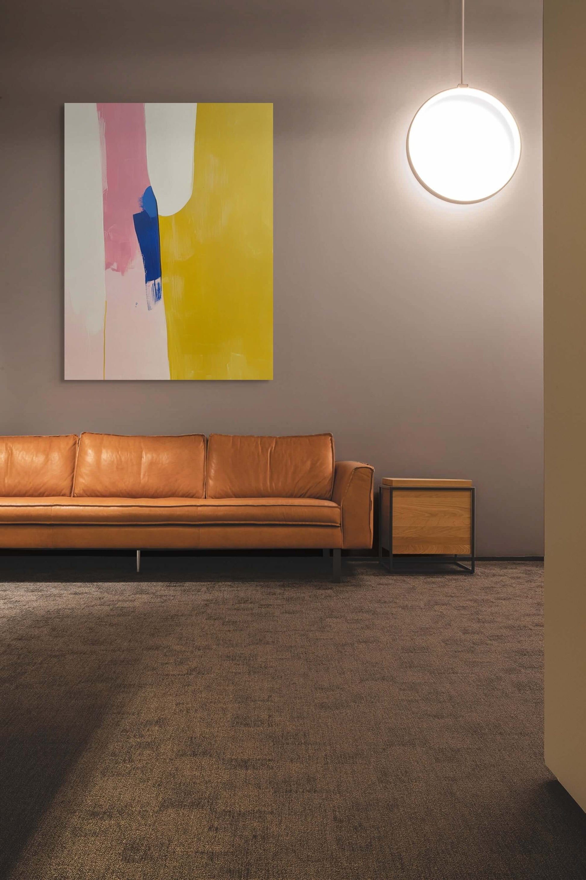 Modern living room featuring 'Thresholds' oil painting with abstract colors and a stylish leather sofa.